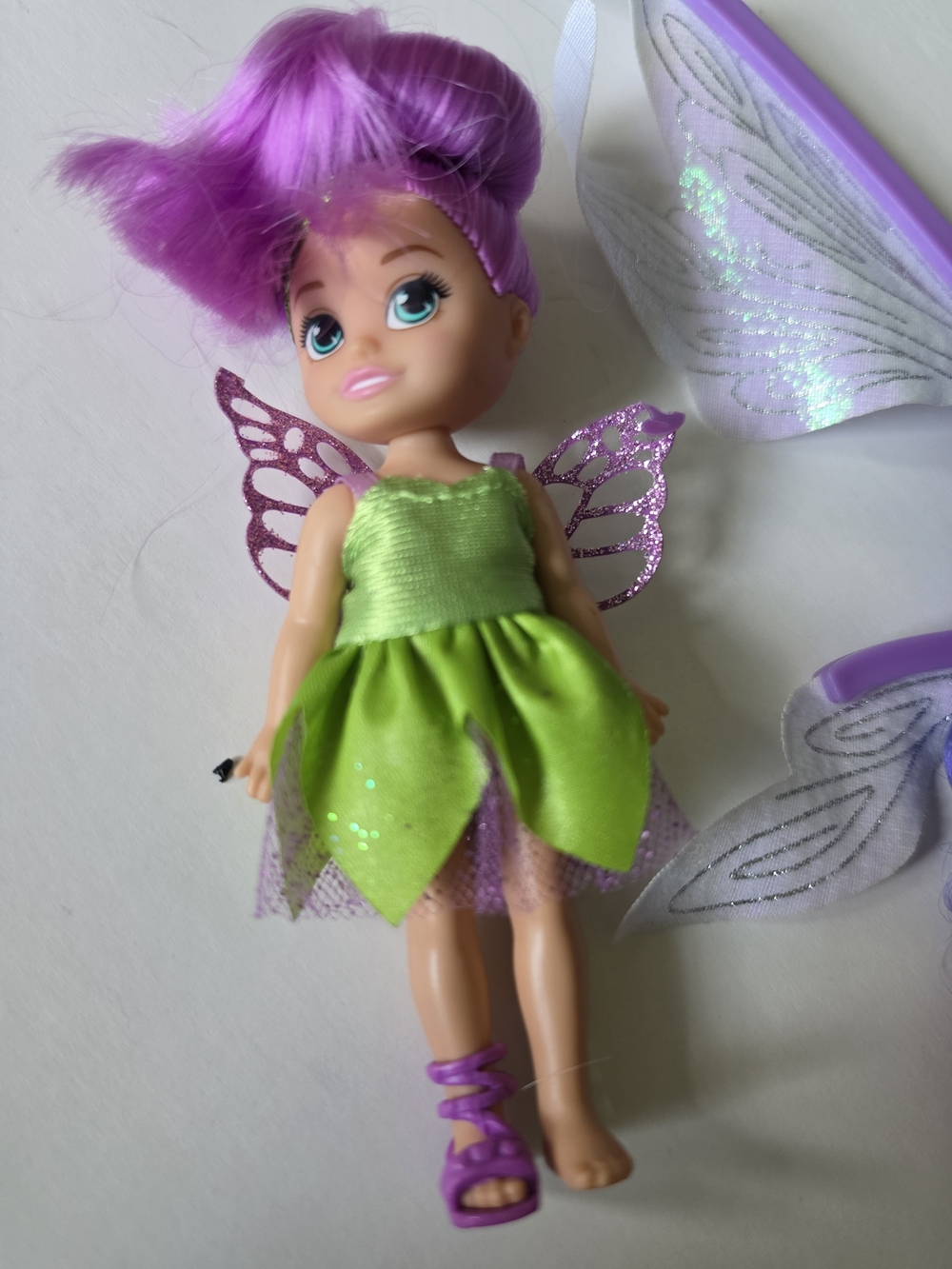 a ZURU Sparkle Girlz mini fairy doll